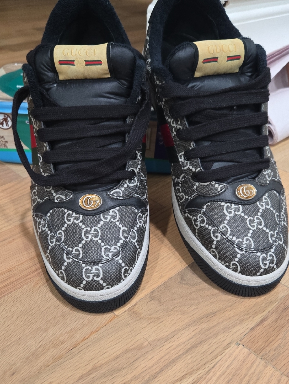 Gucci Black and White GG Monogram Low-Top Sneakers with Gold Accents